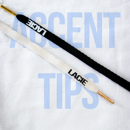 LACIE Accent Tips Laces in black and white with the logo near the gold aglets
