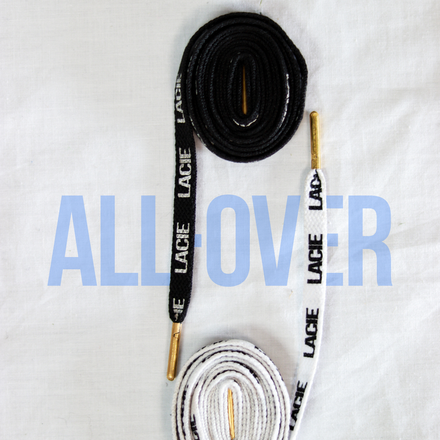 LACIE All-Over Lace in black and white, coiled, with gold metal aglets